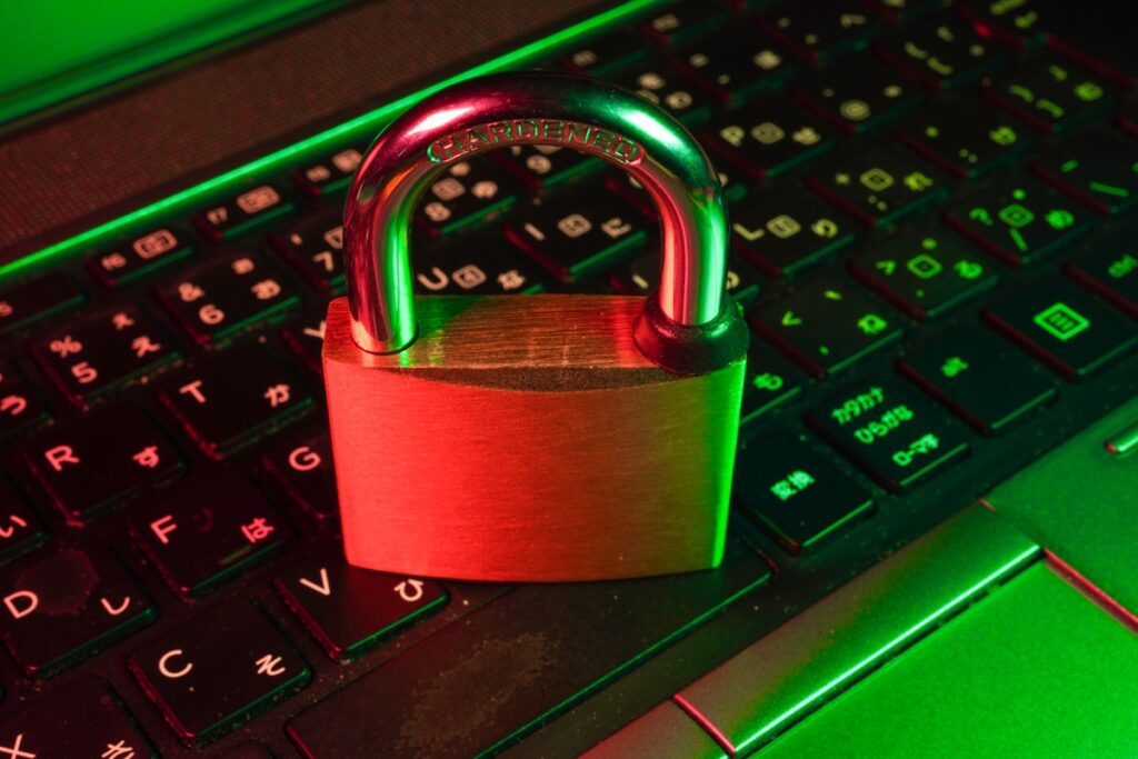 Padlock on a laptop keyboard representing digital security and password protection