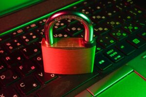 Padlock on a laptop keyboard representing digital security and password protection